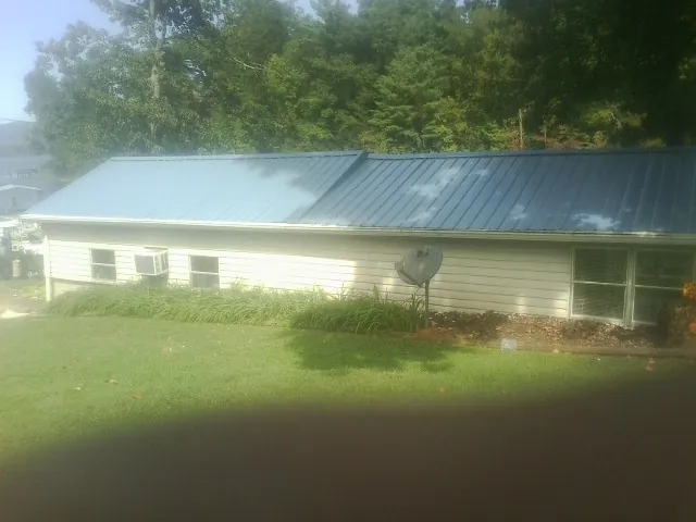 Blue metal roof running the length of a single story home in Johnsonville